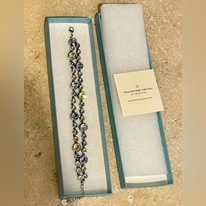 Touchstone Crystal Retired Garland Bracelet. Hues of pink, purple, light yellow